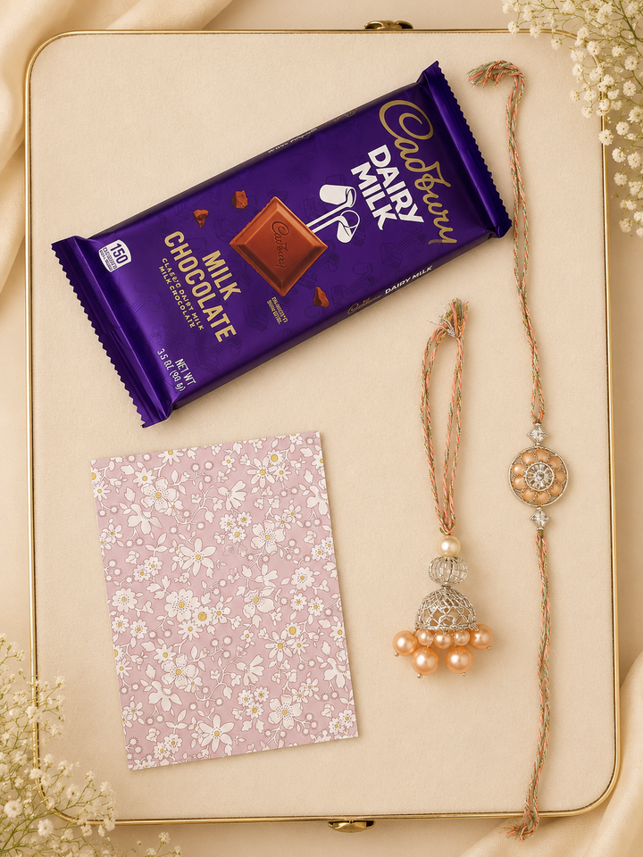 Blush Bloom Raksha Bandhan gift set with peach rakhi, lumba, chocolate, greeting card, and roli.