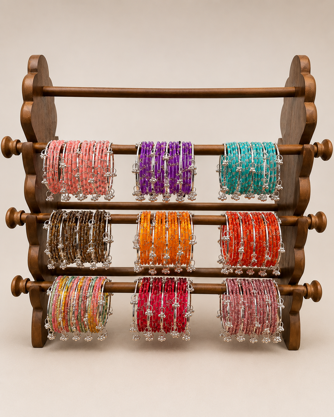 Wooden bracelet holder with colorful bracelets on a beige background