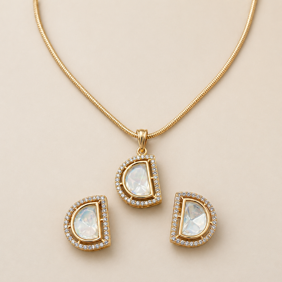 Gold necklace with teardrop-shaped pendants on a beige background