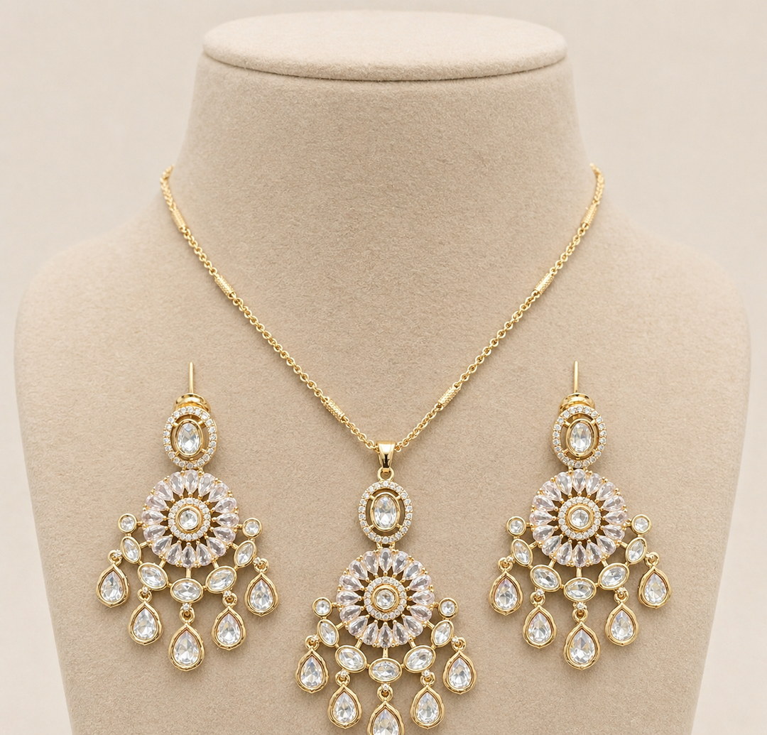 Gold jewelry set with necklace and earrings on a beige stand