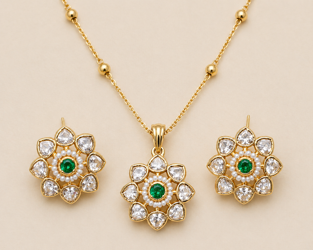 necklace set with floral-inspired design centered with a rich jewel-toned accent and surrounded by luminous stones.